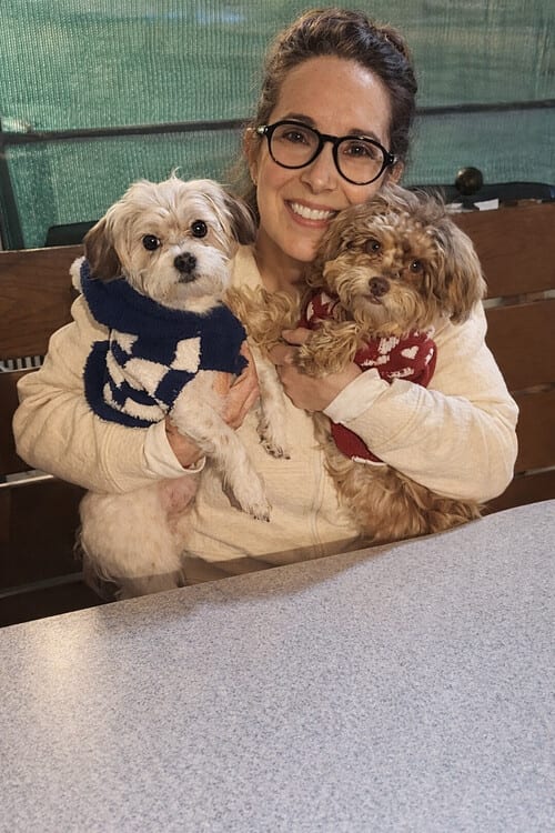 Our mom, Mercy, holding Yogi and Mia in their sweaters